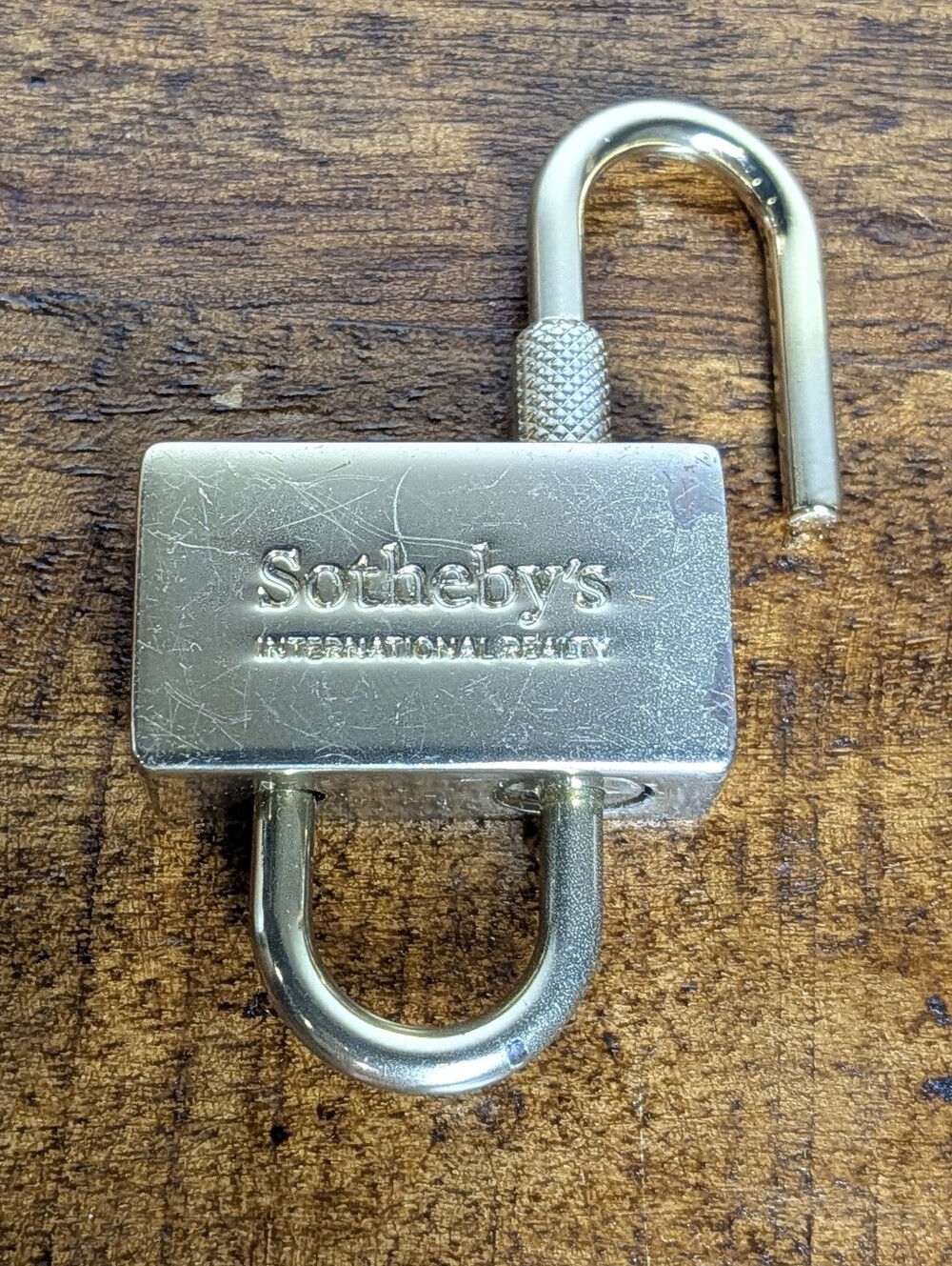 Sothebys Gold Colored Promotional Swing Lock Keyless Padlock Bag Charm Keychain